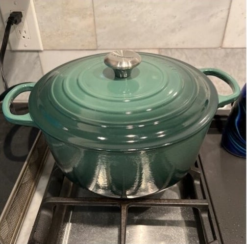Enameled cast iron Dutch oven on a stove top, no persons present