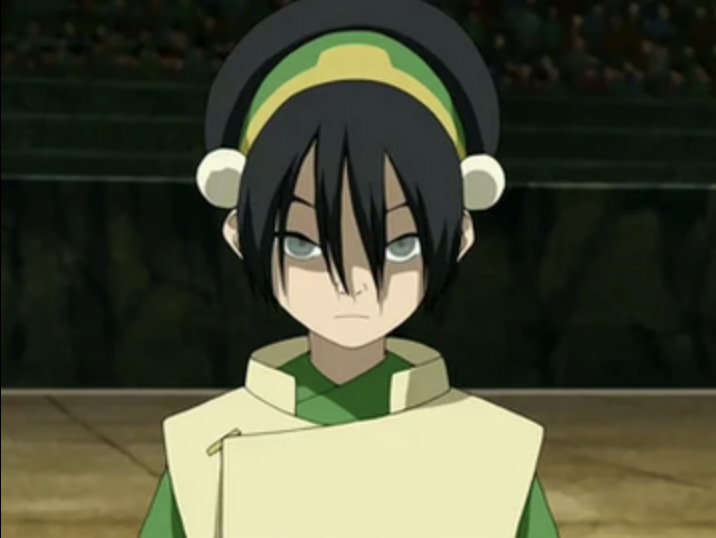 Toph from Avatar: The Last Airbender is shown with a focused expression