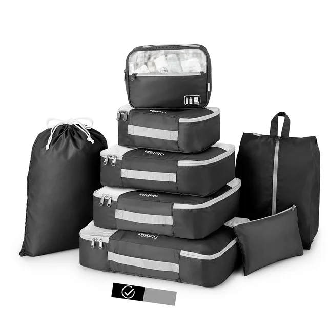 Assorted packing cubes and bags for organized travel essentials