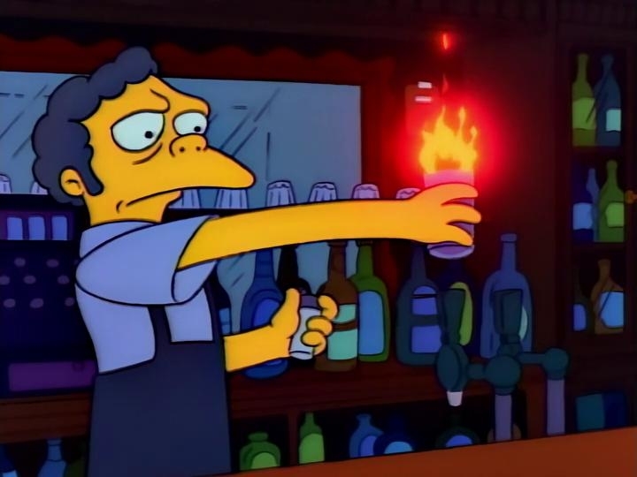 Moe Szyslak from The Simpsons holding a flaming Moe cocktail at the bar