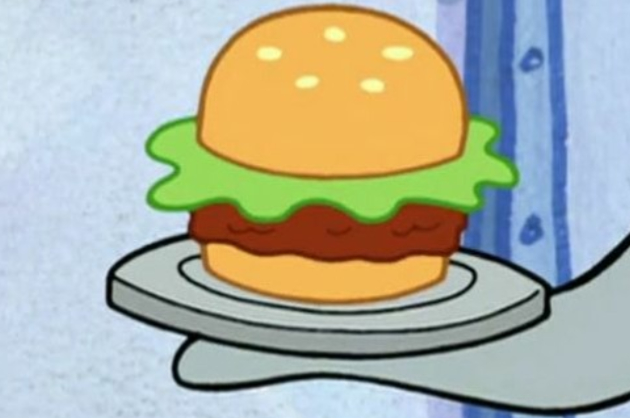 Cartoon character SpongeBob SquarePants holds a Krabby Patty