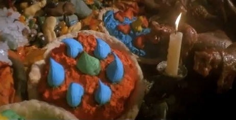 A scene from the film &quot;Hook&quot; showing the imaginary feast with colorful play food and a lit candle
