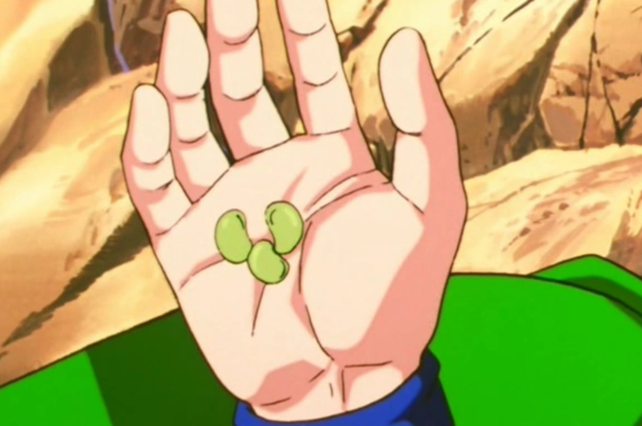 Open hand with a green outfit&#x27;s sleeve, showing a small two-starred sphere in the palm, from the anime Dragon Ball