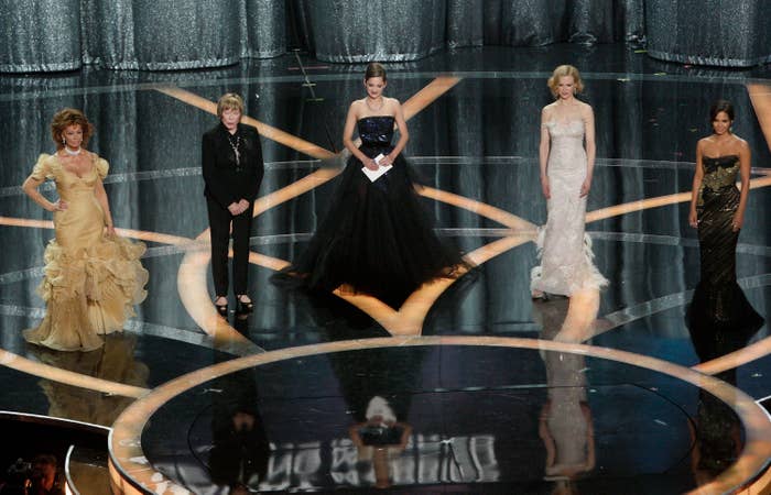 Five women on stage at an award shows
