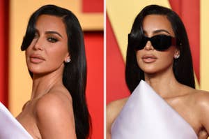 Kim Kardashian poses at an event, wearing oversized sunglasses and a white off-shoulder top
