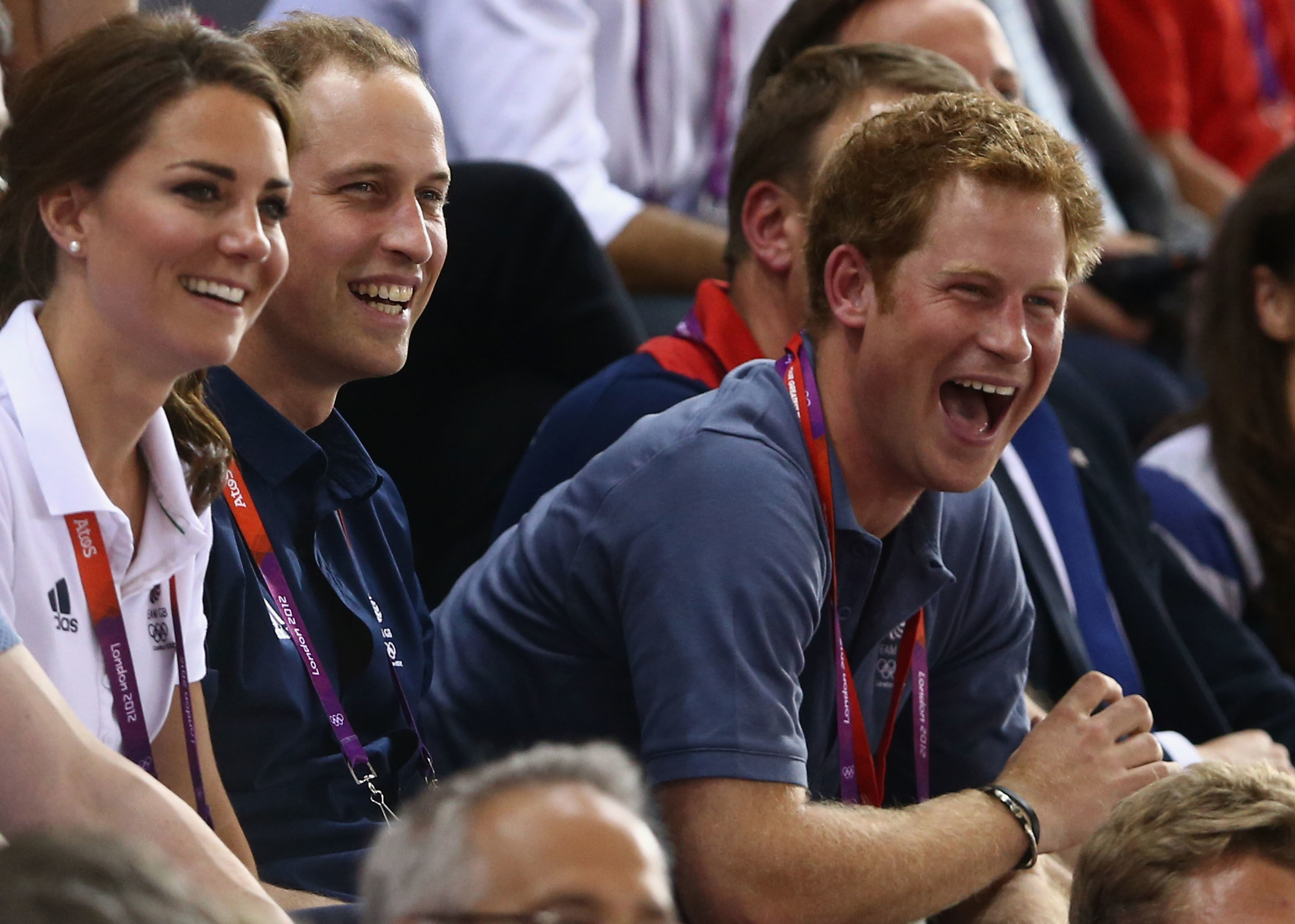 Prince Harry laughing alongside Kate Middleton and Prince William