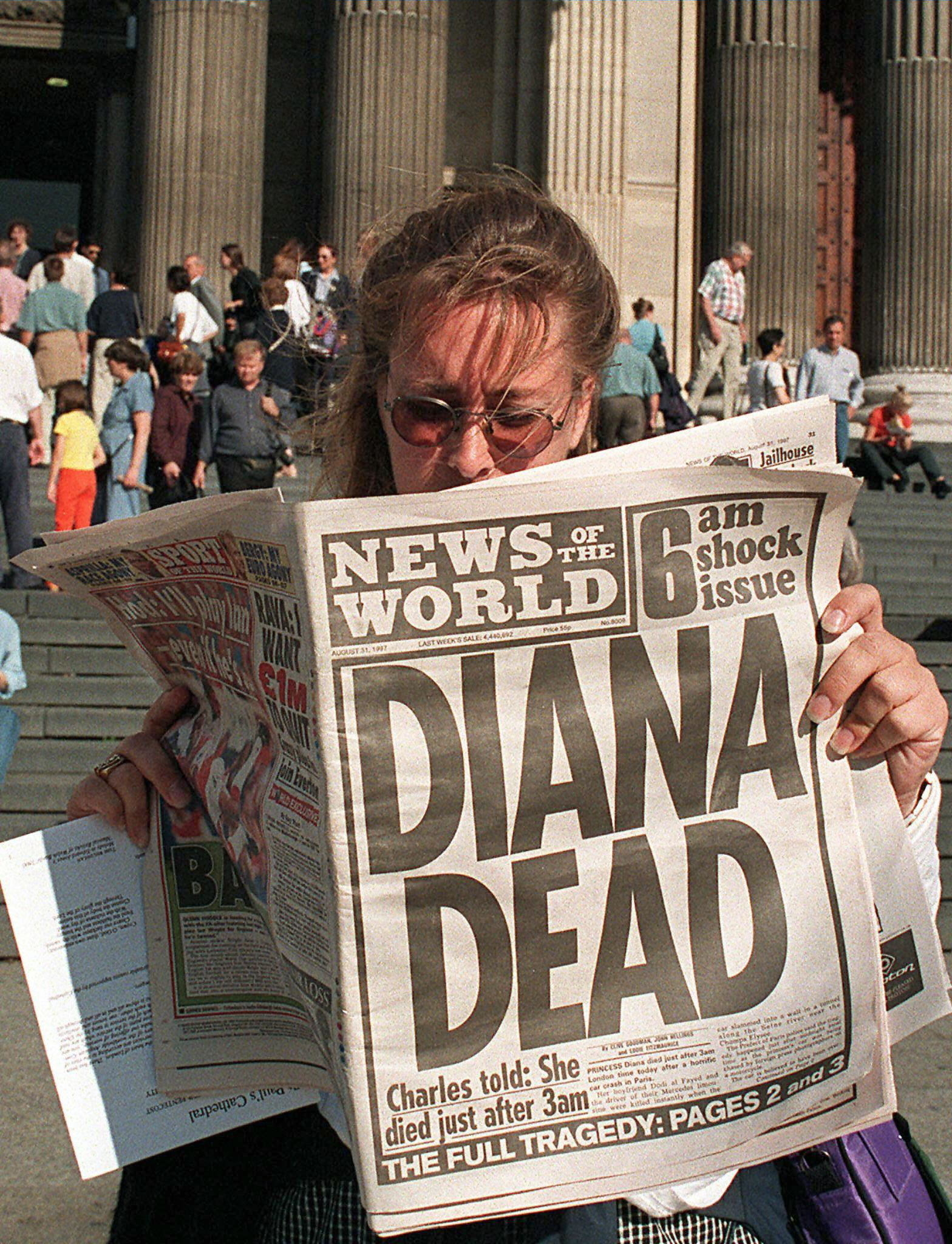 Person reads newspaper headline about Princess Diana&#x27;s death outside a building with steps and columns, conveying the news&#x27; impact