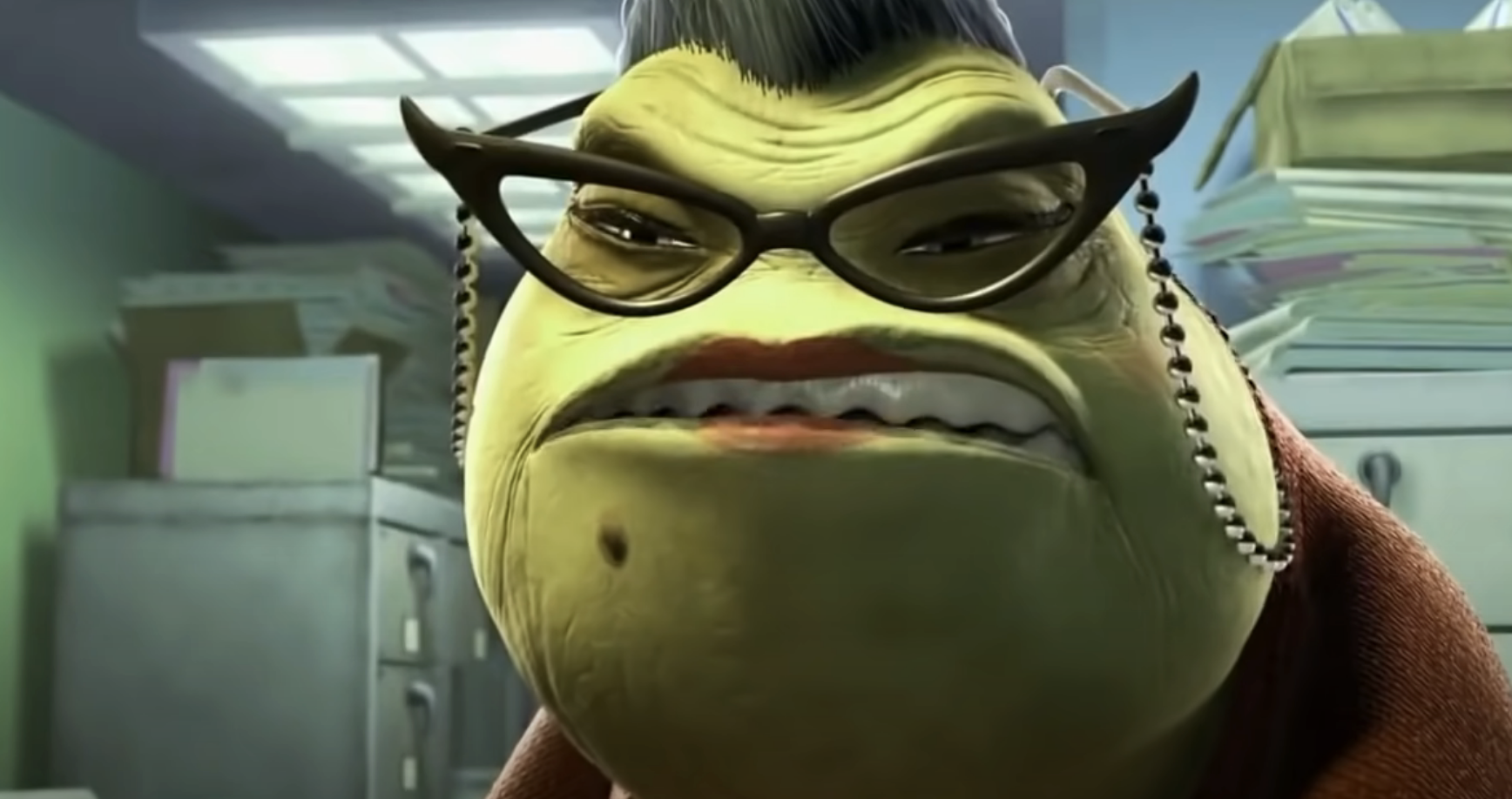 Animated character Roz from Monsters, Inc. with glasses and a visible frown