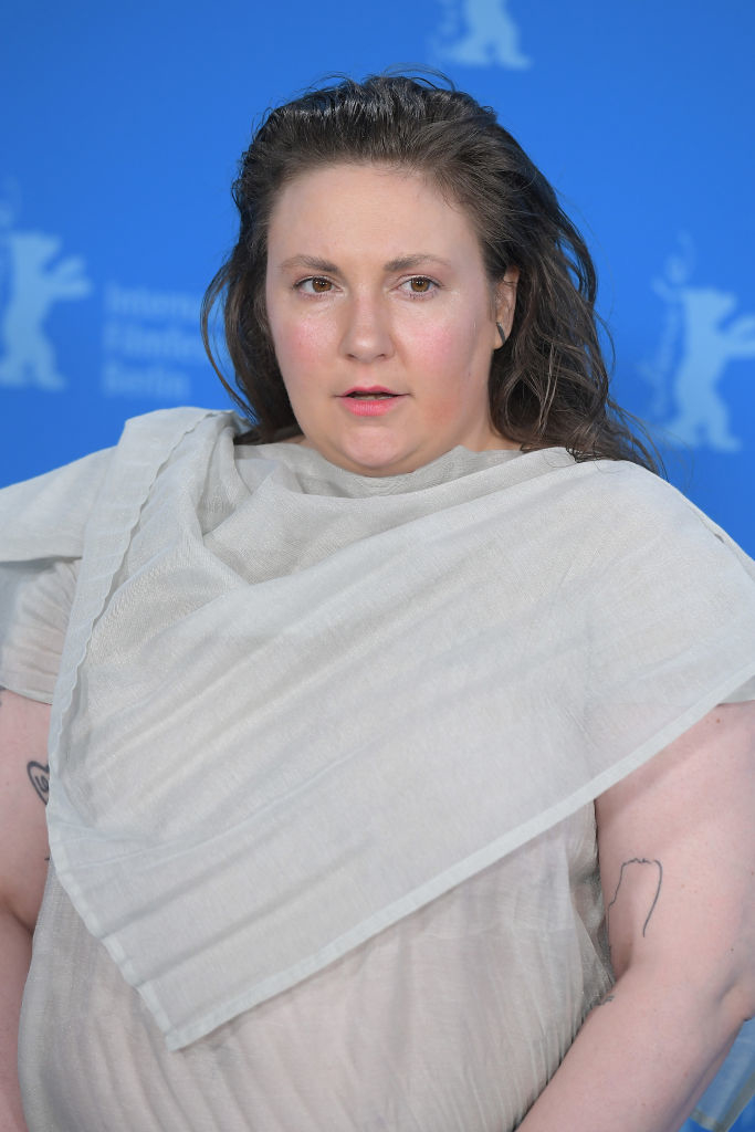 Lena Dunham in a draped off-the-shoulder dress at a film event