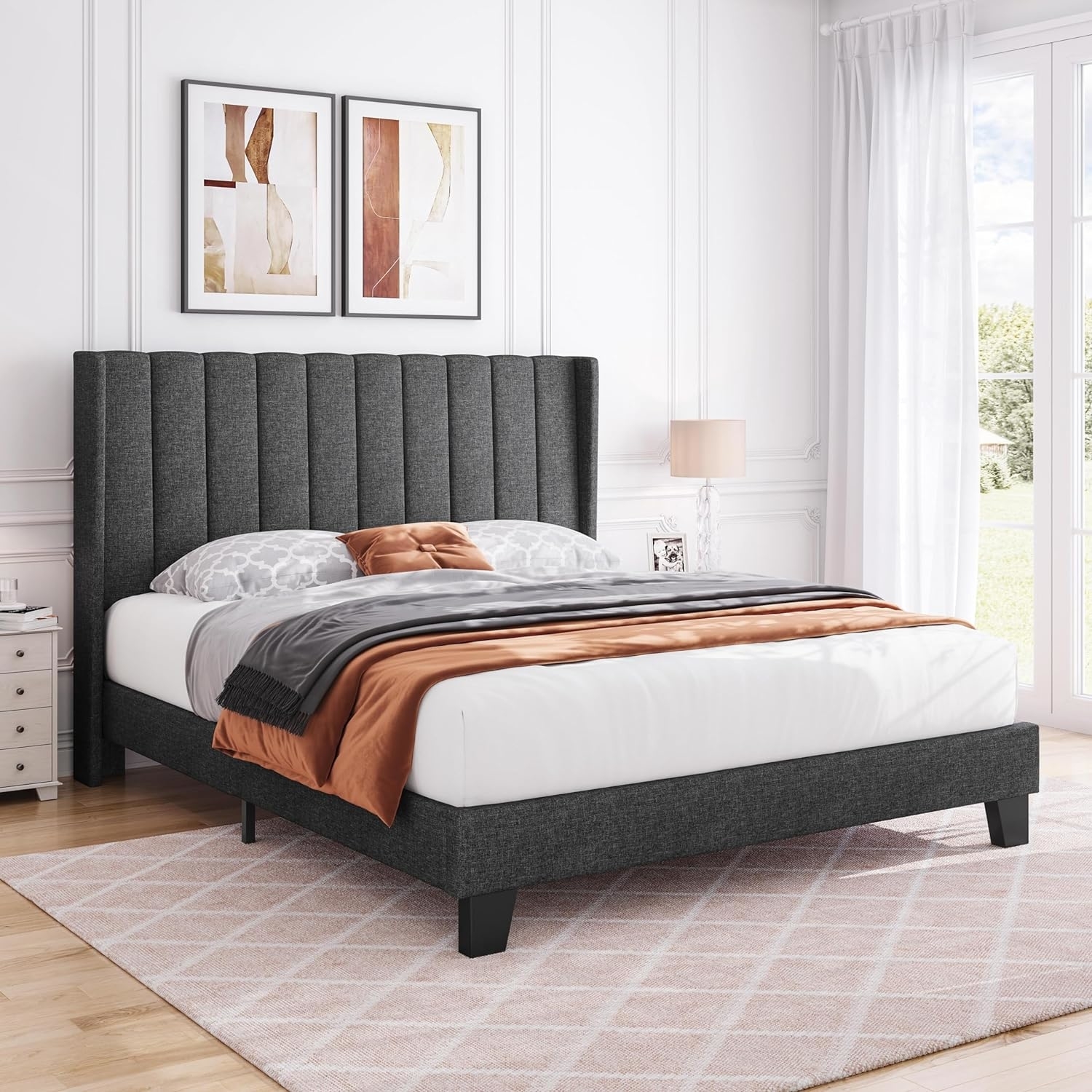 Modern upholstered bed with a geometric headboard and coordinated bedding set in a styled bedroom