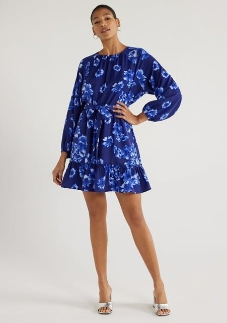 Model wearing blue floral fit-and-flare dress