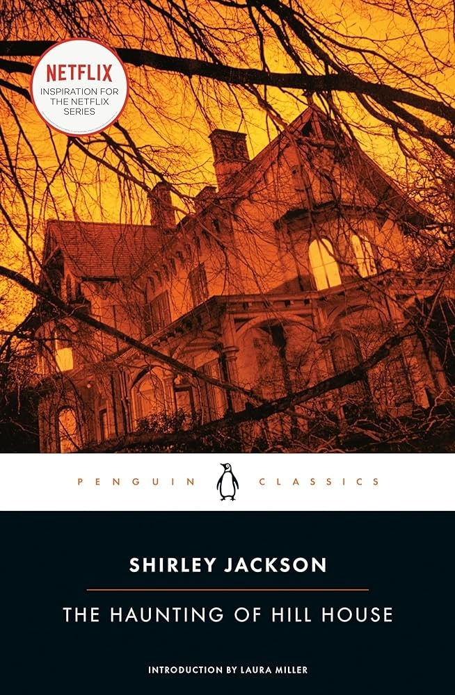 Cover of &quot;The Haunting of Hill House&quot; book, with a silhouette of a spooky house against a twilight sky, Netflix series mentioned
