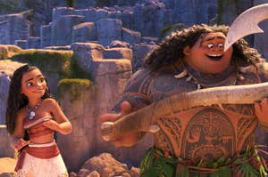 Animated characters Maui and Moana smiling, Maui holding a magical hook, in a tropical setting from the movie "Moana."