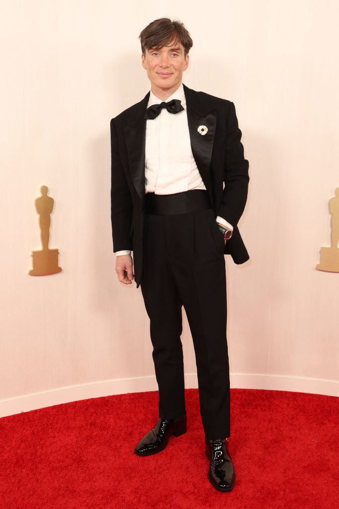 Cillian in a tuxedo with bow tie posing on the red carpet