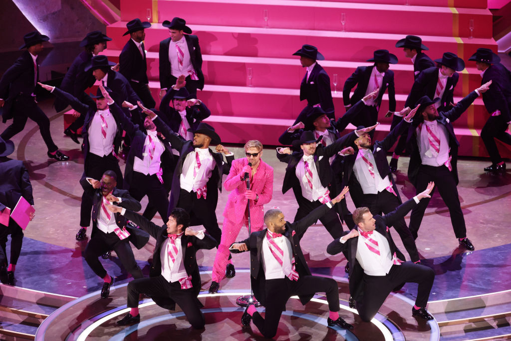 Ryan Gosling performing onstage at the Oscars with many backup dancers