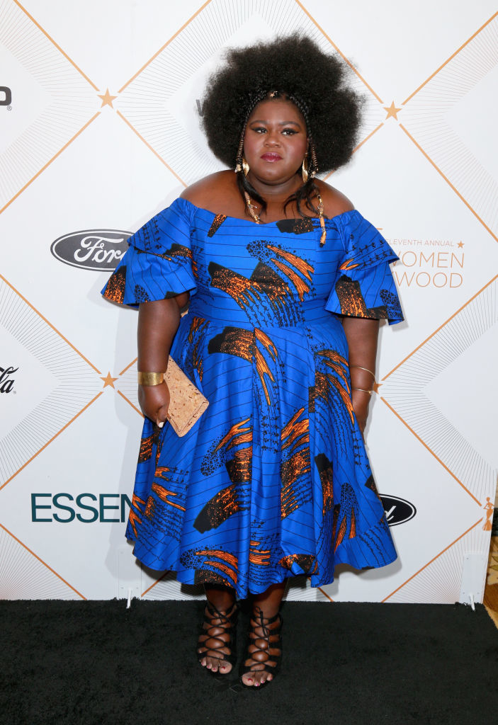 Gabourey Sidibe in a patterned dress and sandals at an event
