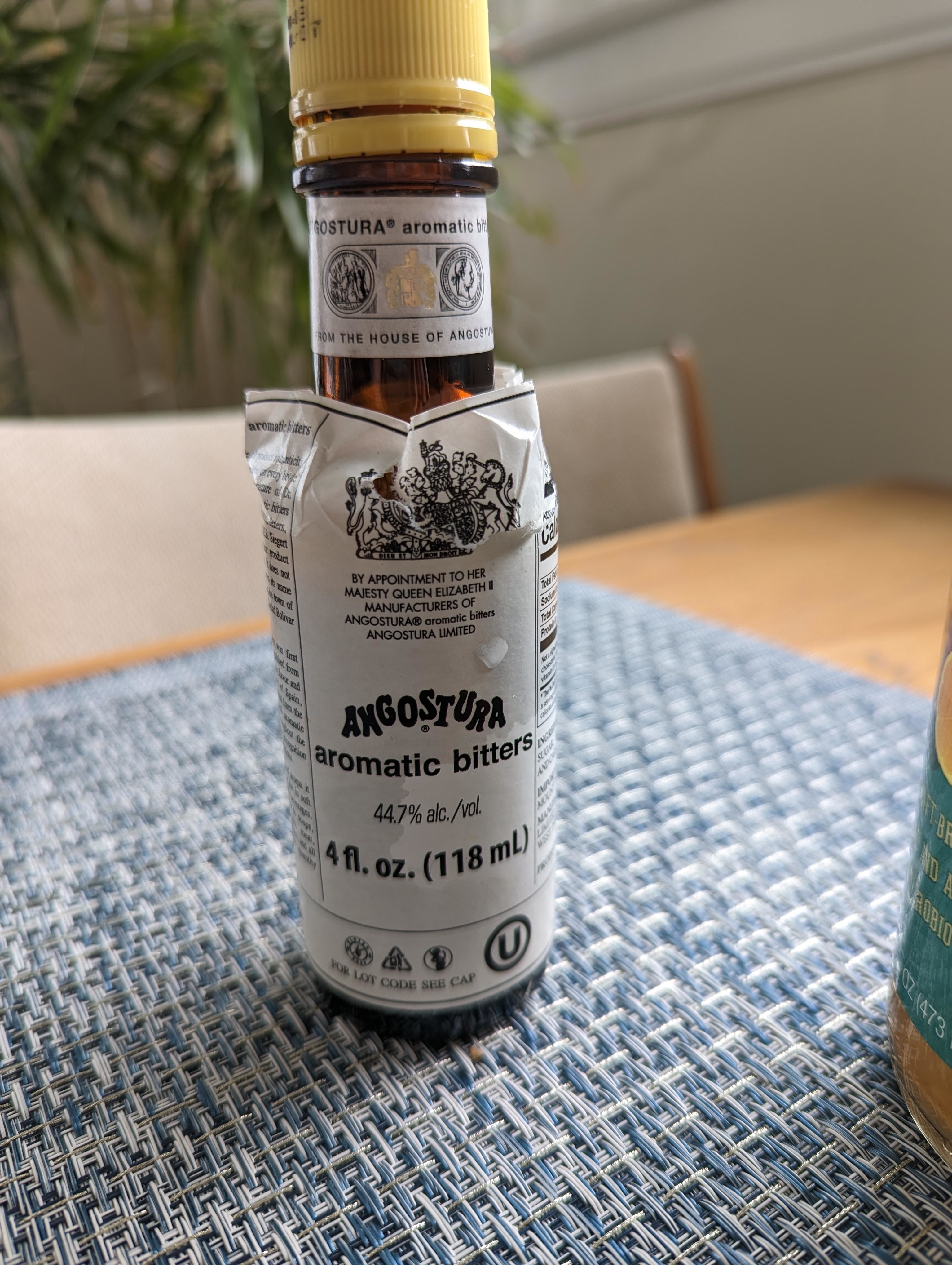 Bottle of Angostura aromatic bitters on a table