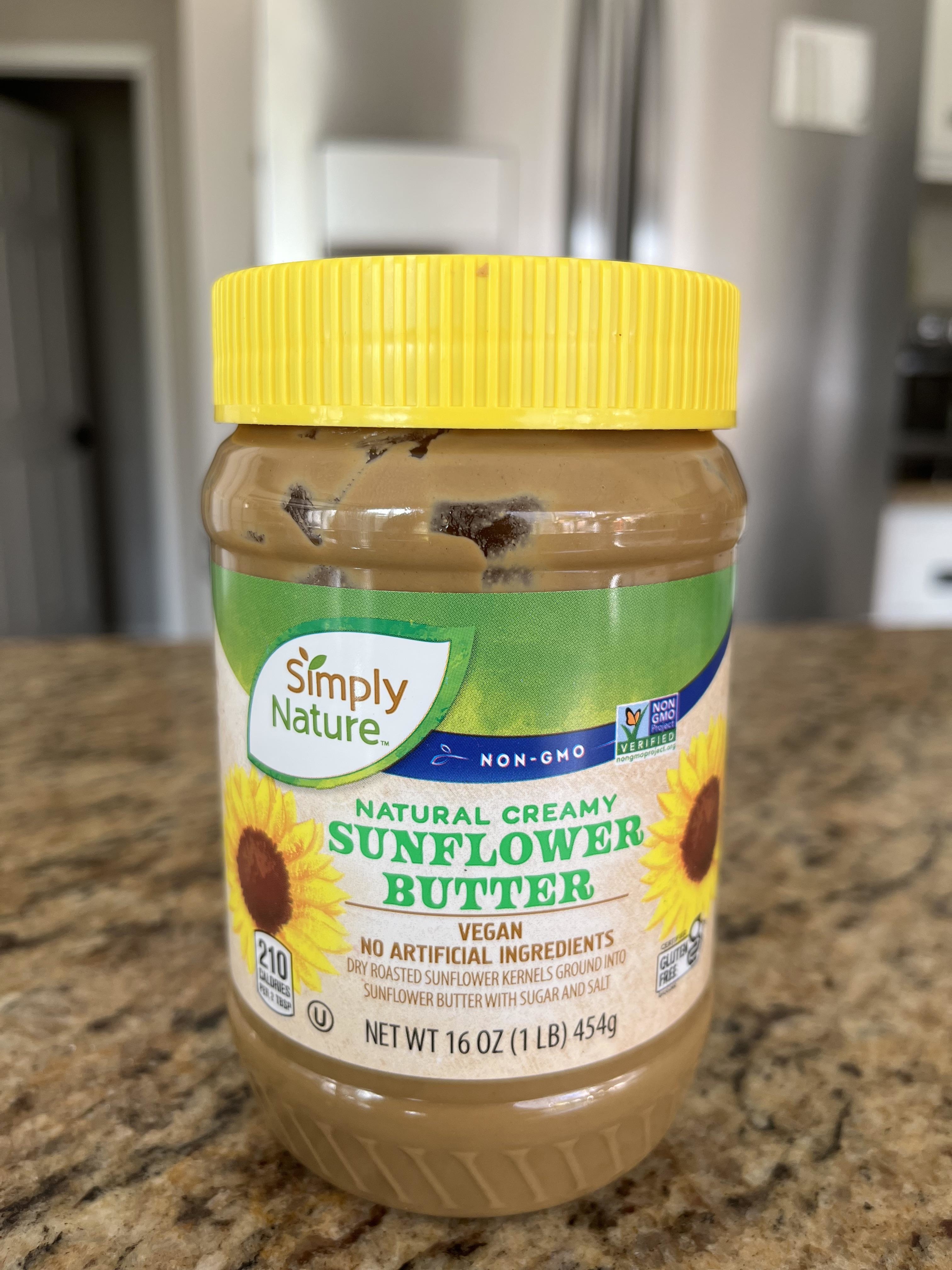 A jar of Simply Nature creamy sunflower butter on a kitchen counter