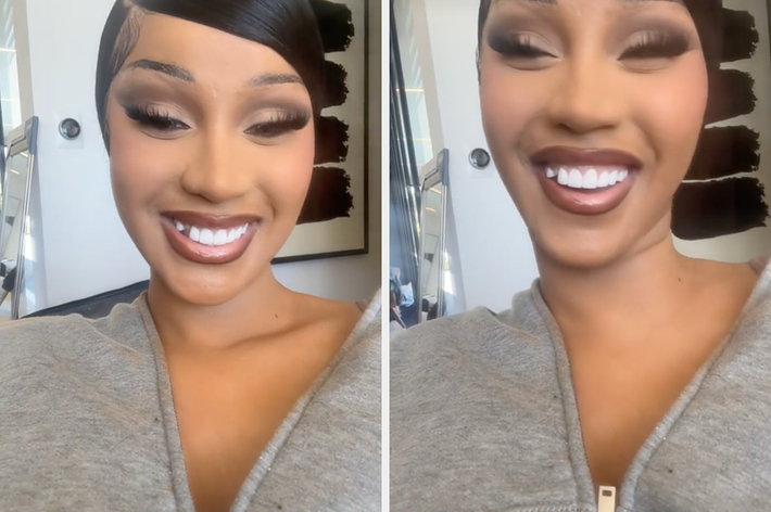 Megan Thee Stallion with a smile, wearing makeup and a casual top