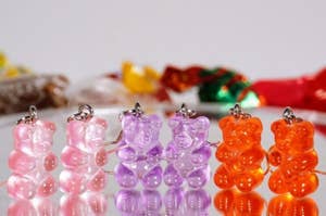  gummy bear-shaped drop earrings in pink, purple, and orange