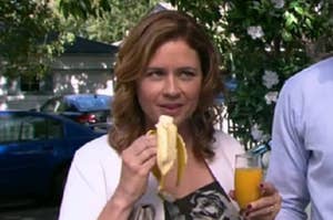 Pam Beesly eating a banana and a mimosa.