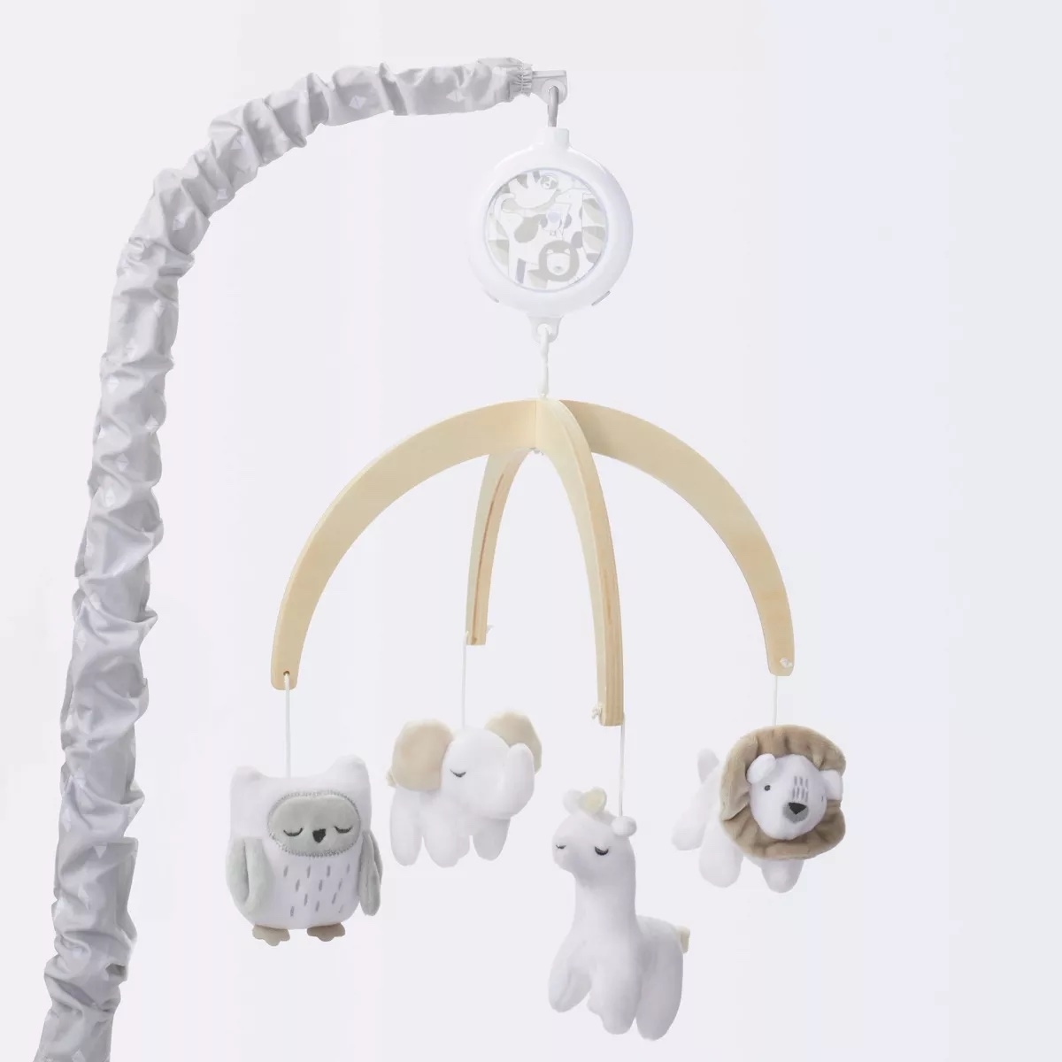 Baby mobile with plush owl, sheep, llama, and dog toys hanging, designed for a crib