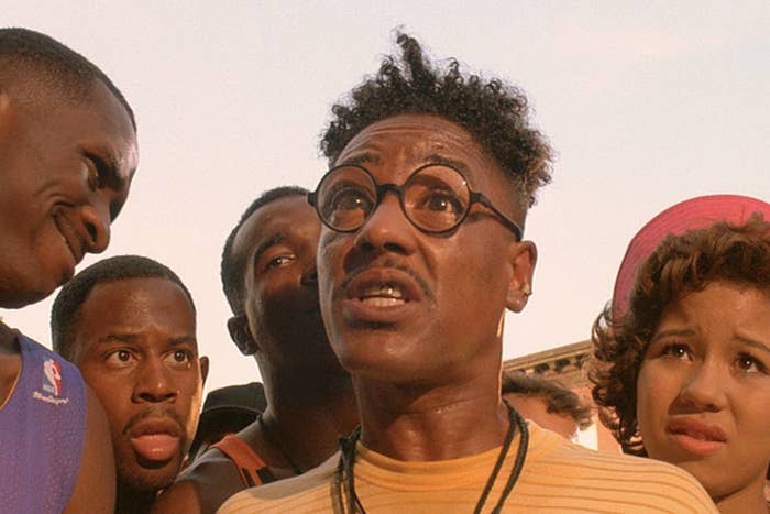 Group of individuals displaying a range of expressions, focused on a person at the center who appears surprised or concerned