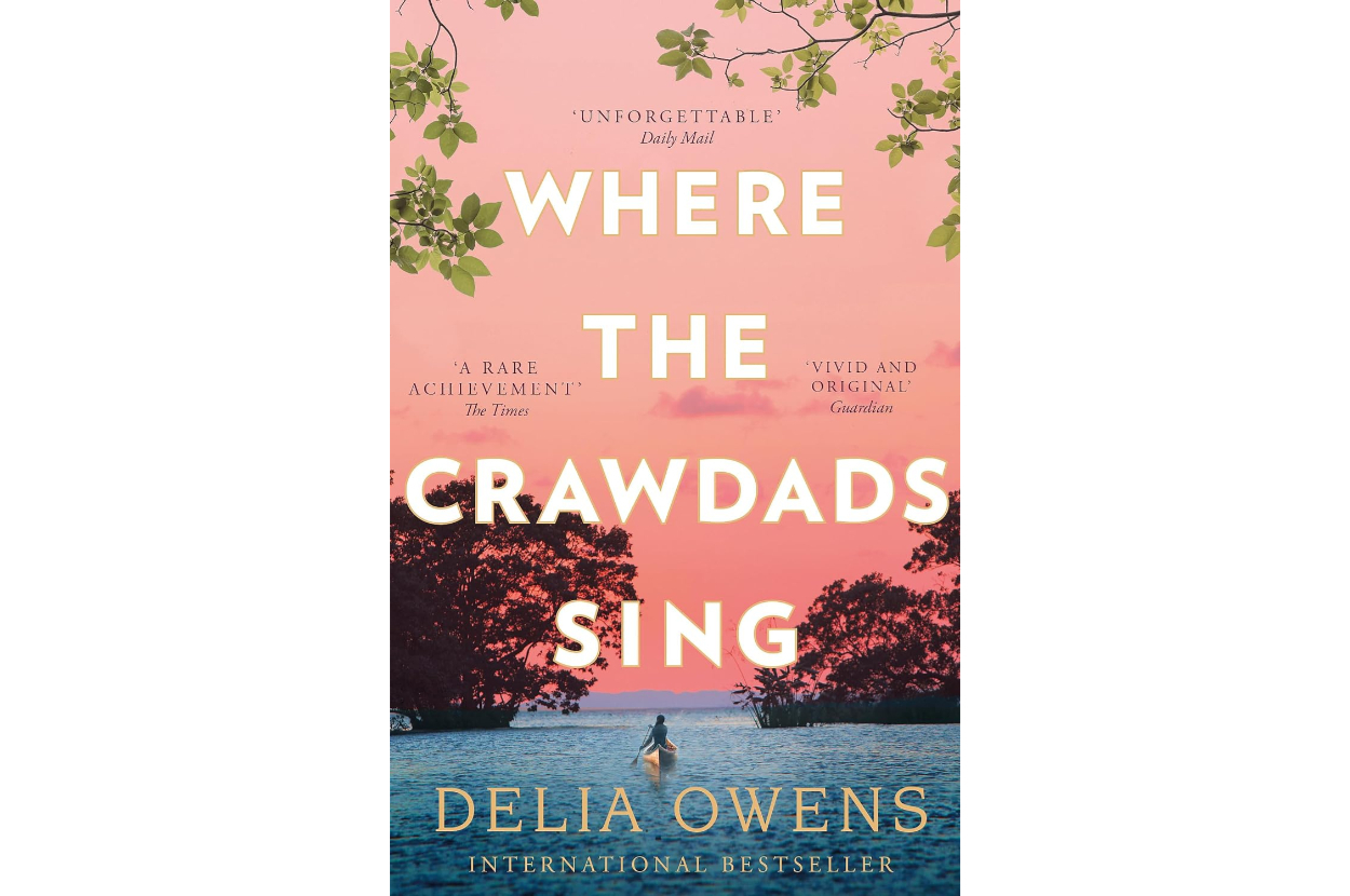 Book cover of &quot;Where the Crawdads Sing&quot; by Delia Owens with praise quotes and a tree silhouette