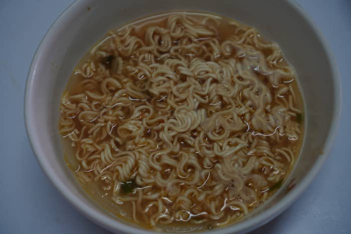 A bowl of instant noodles with broth