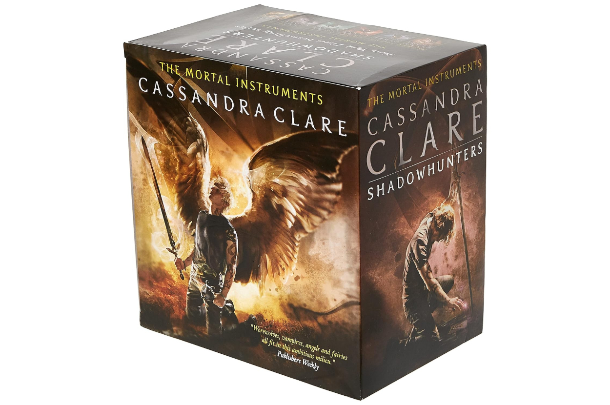Boxed set of &#x27;The Mortal Instruments&#x27; series by Cassandra Clare, featuring angelic imagery