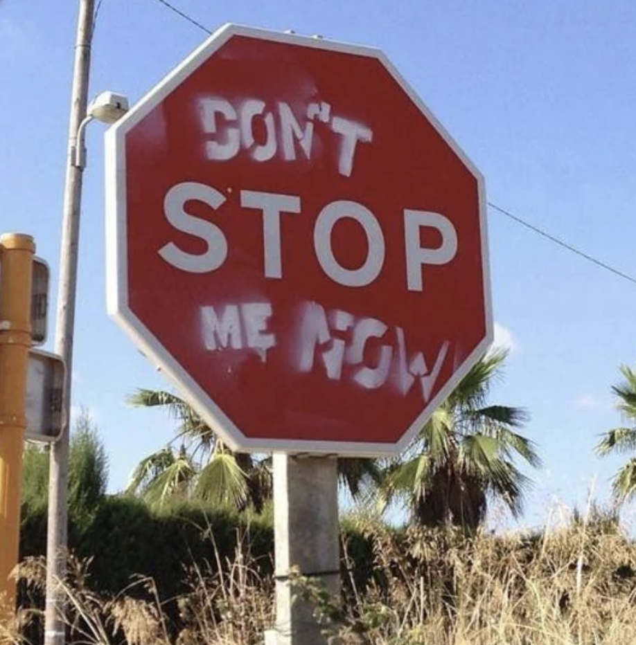 A modified stop sign with the phrase &quot;DON&#x27;T STOP ME NOW&quot; written on it