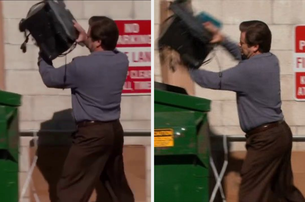 A person violently smashing an office machine outside near a dumpster