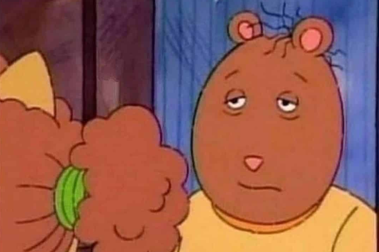 Arthur Read from &quot;Arthur&quot; looks unamused while squeezing a bouquet, hinting at relationship context