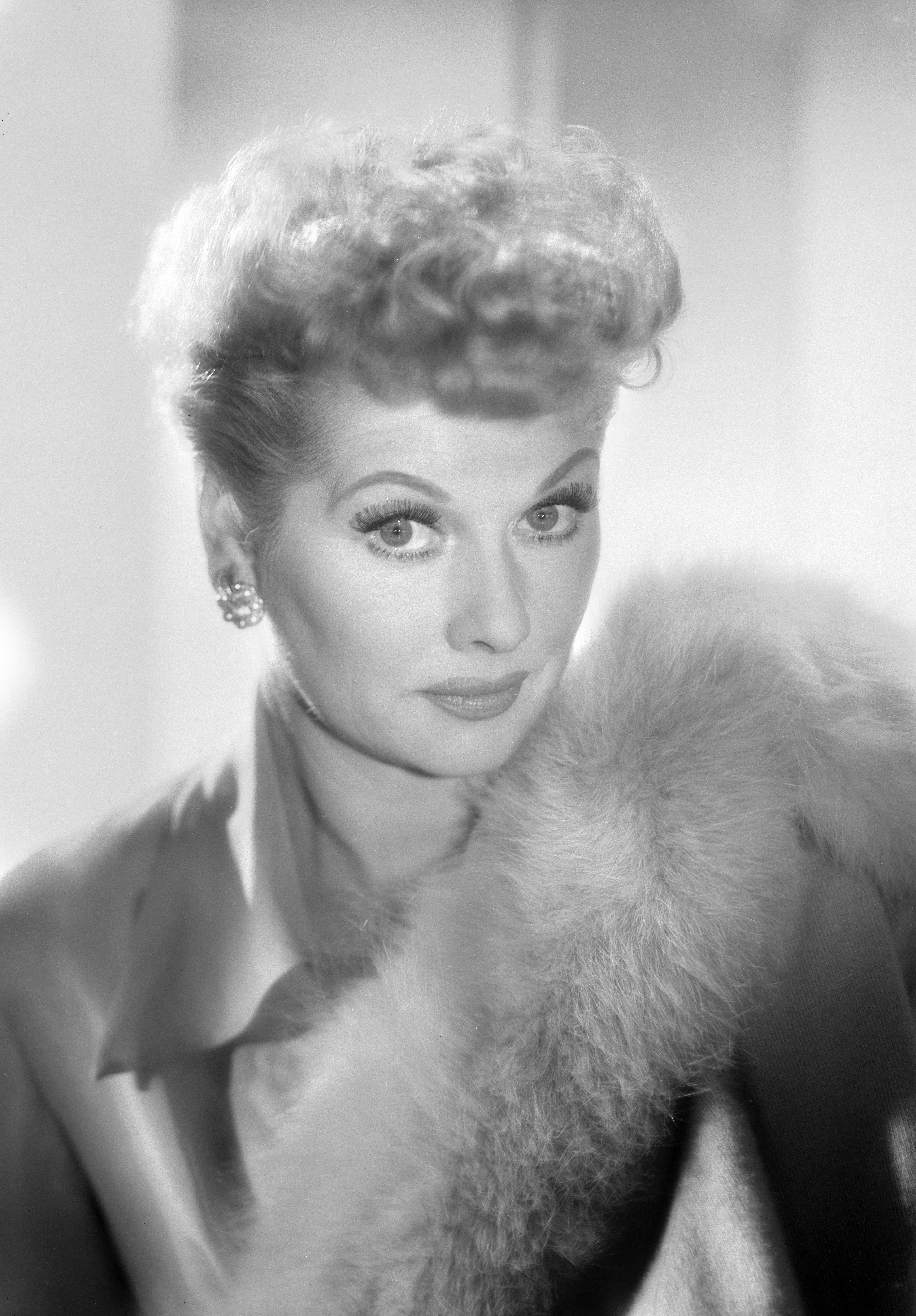 Lucille Ball in a formal portrait with fur stole and classic hairstyle