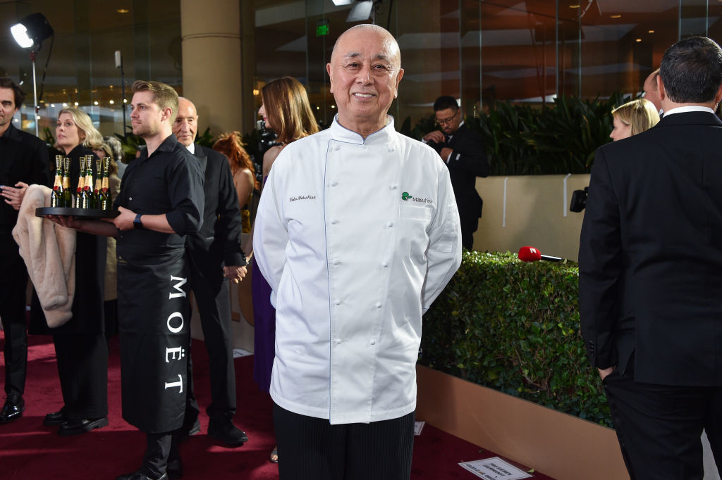 Nobu Matsuhisa in chef jacket posing at event
