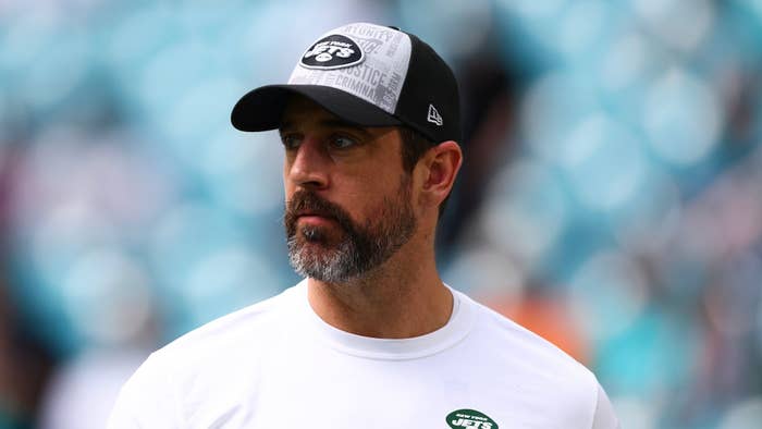 Person with beard wearing a baseball cap and headset, affiliated with the New York Jets