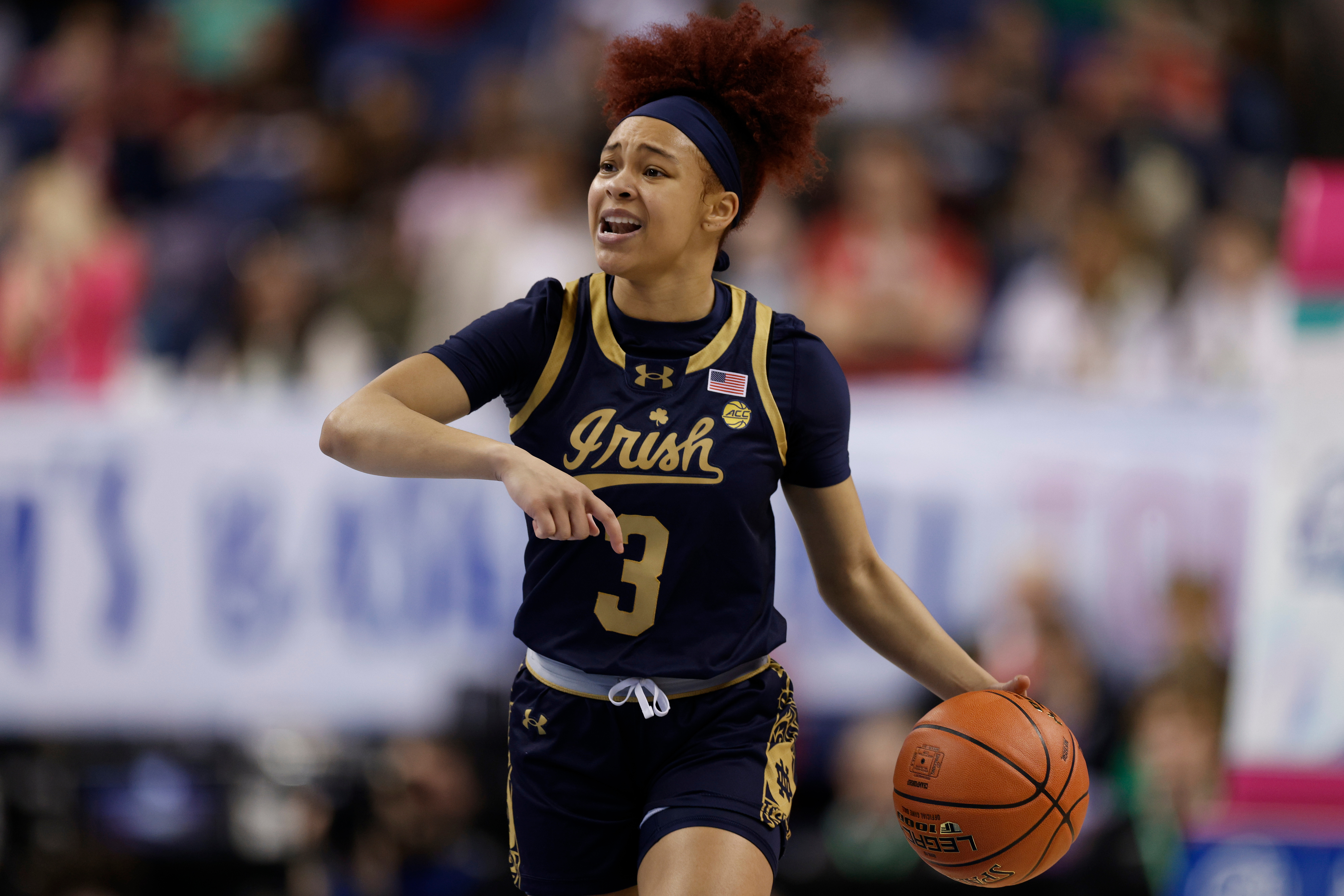 Notre Dame basketball player in action, dribbling during a game