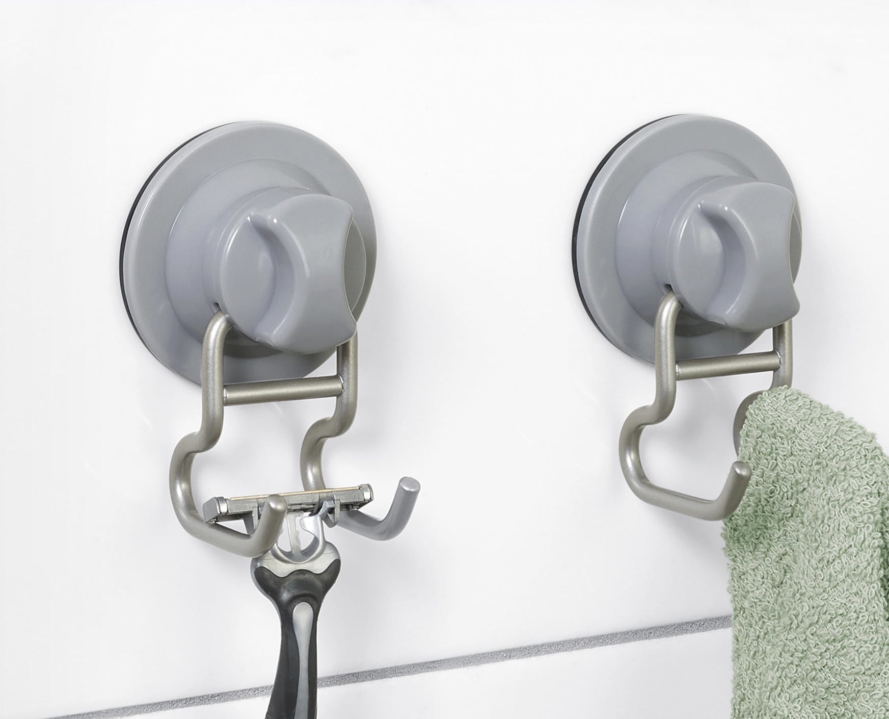 Two suction-cup hooks holding a razor and towel, labeled as &quot;Rust Resistant&quot; and &quot;2 PACK&quot;