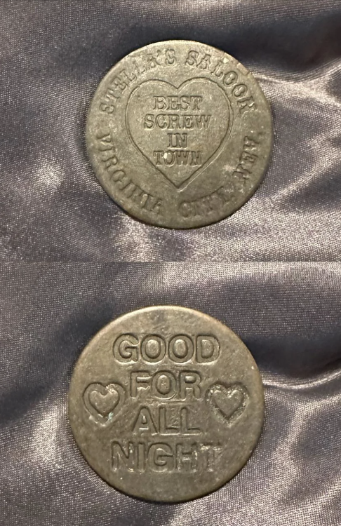 Two novelty coins with inscriptions; top says “Best Screw in Town,” and bottom “Good For All Night.”