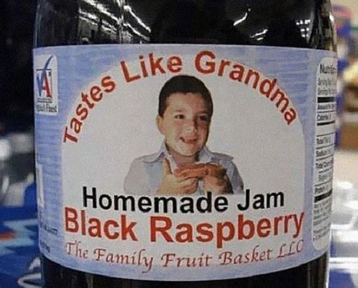 Label on jam jar reads &quot;Tastes Like Grandma, Homemade Jam Black Raspberry&quot; with a child&#x27;s photo