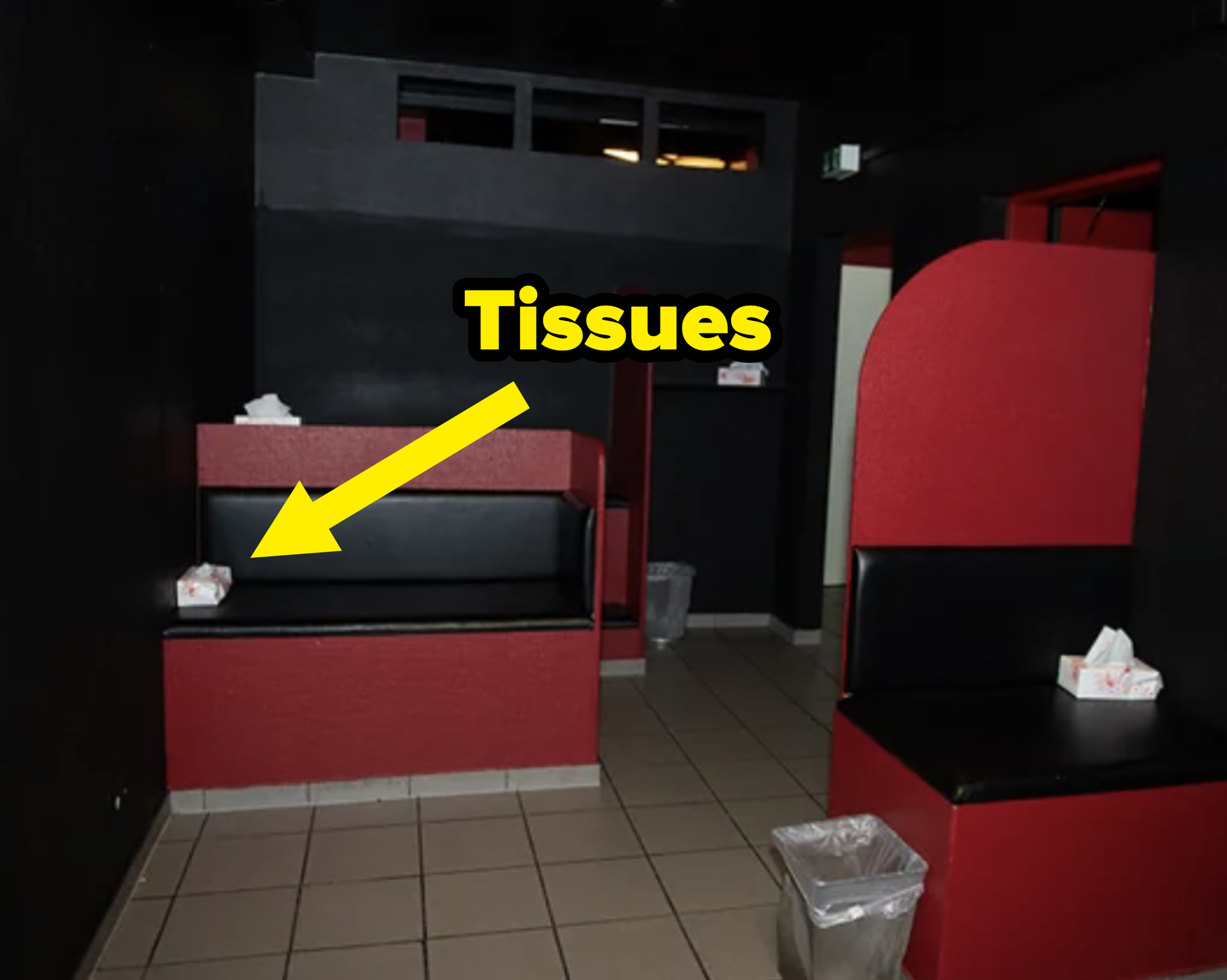 Empty movie theater seats with tissues on them, suggestive of a pornographic film