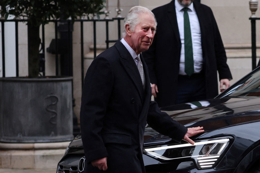 King Charles walking to car