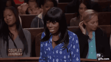 A woman in court freezing with a surprised expression