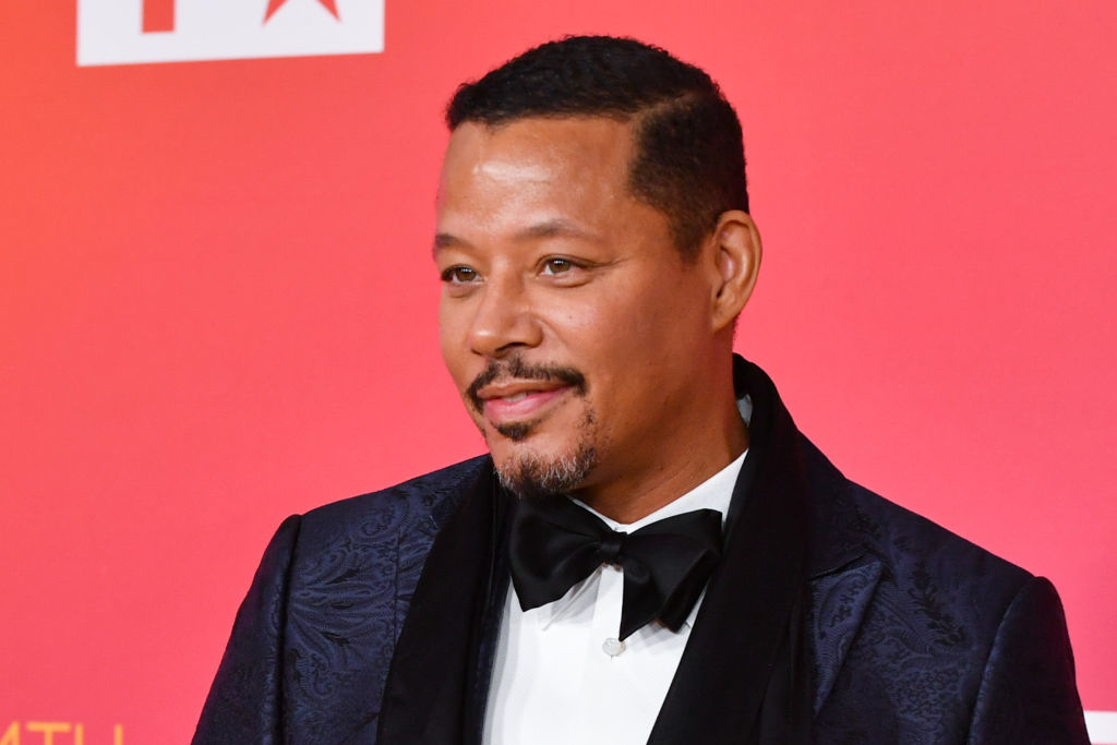 Terrence in an elegant suit with a bow tie at an event