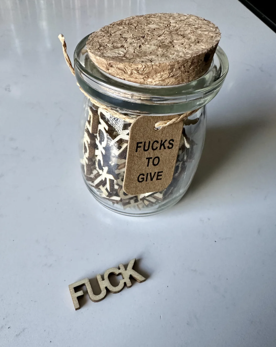 a jar with the label &quot;fucks to give&quot;