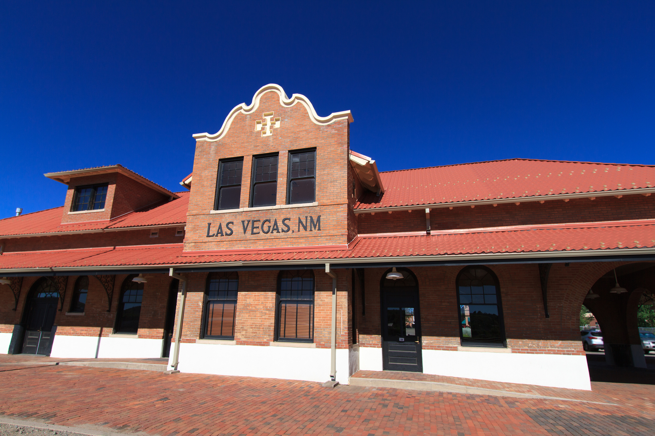 Historic train station building with &#x27;LAS VEGAS, N.M.&#x27; sign