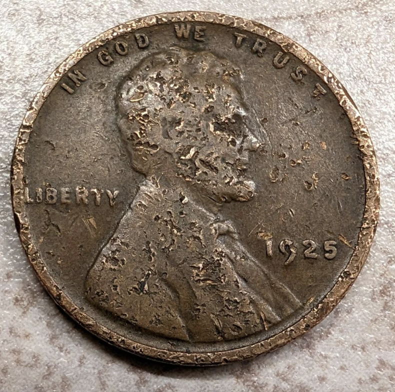 United States Lincoln wheat penny from 1925 with visible wear and tear