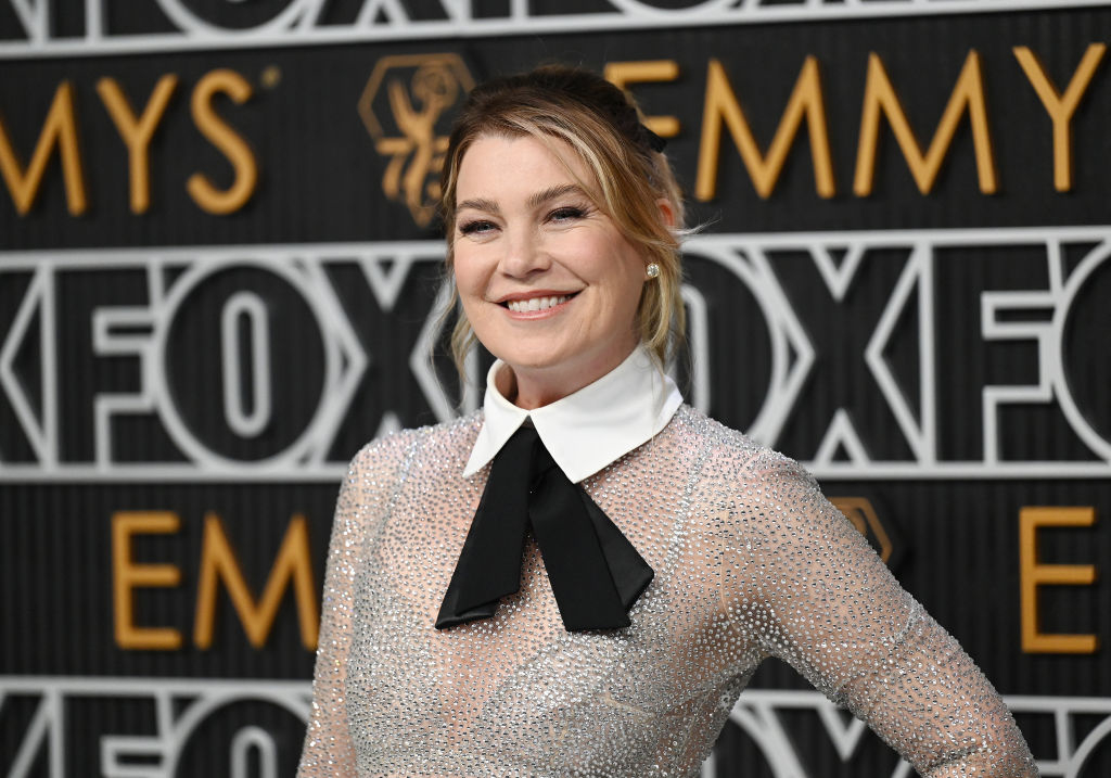 Woman at an event in a sparkly dress with a white collar and black bow tie