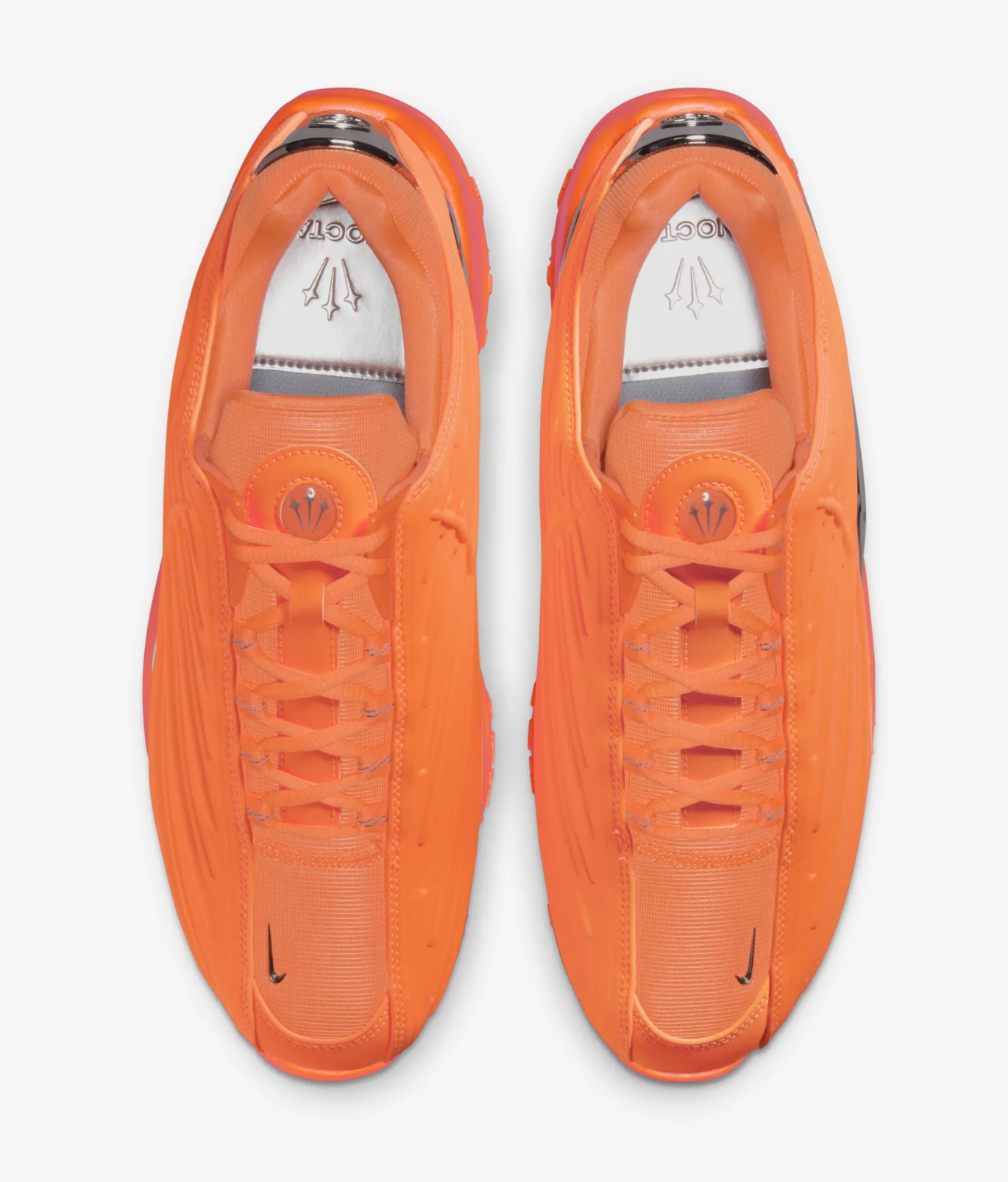 Top view of a pair of Nike Air Max sneakers in orange with laces tied, on a white background