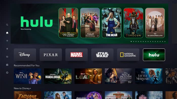 Screen displaying Hulu and Disney+ streaming service interfaces with various movie and show thumbnails